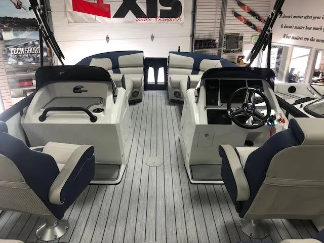 Slide: The Image of 2020 Montara 25' Surf Boss boat interior with seating and steering wheel, showcasing modern design. - 11