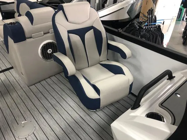 Slide: The Image of 2020 Montara 25' Surf Boss boat interior with plush seating and modern design. - 16