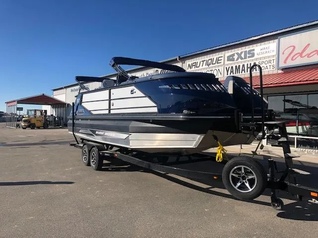 Slide: The Image of 2020 Montara 25' Surf Boss boat on trailer, parked outside dealership. - 4