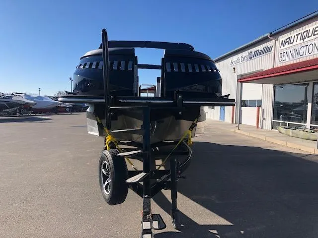 Slide: The Image of 2020 Montara 25' Surf Boss boat on trailer at dealership, sunny day. - 5