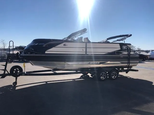 Slide: The Image of 2020 Montara 25' Surf Boss boat on trailer under bright sunlight. - 7