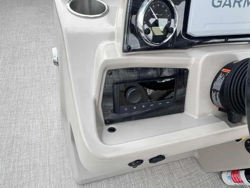 Slide: The Image of Close-up of the 2023 Avalon 2185 Venture CR2 boat dashboard with Garmin display. - 11