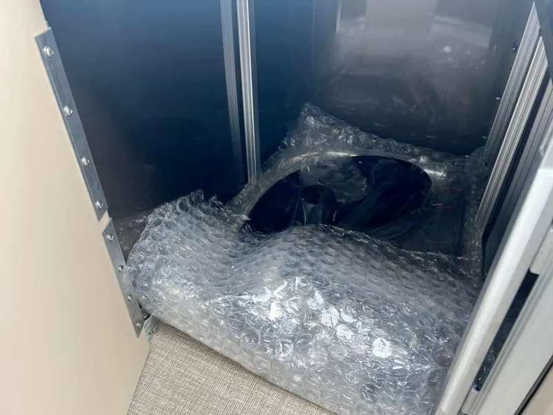 Slide: The Image of Bubble-wrapped components inside Avalon 2185 Venture CR2, 2023 model. - 13