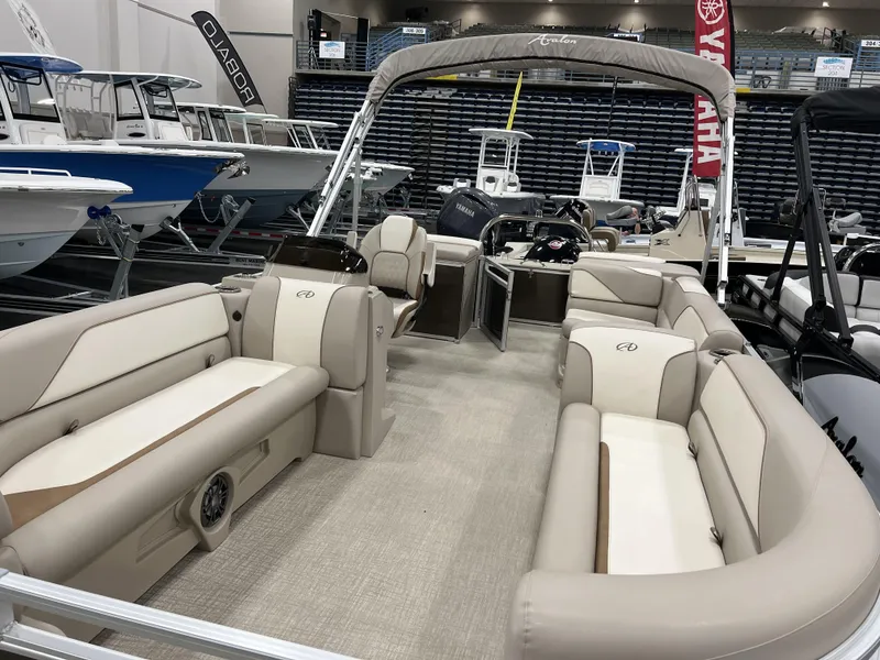 Slide: The Image of 2023 Avalon 2185 Venture CR2 pontoon boat interior at a boat show. - 17