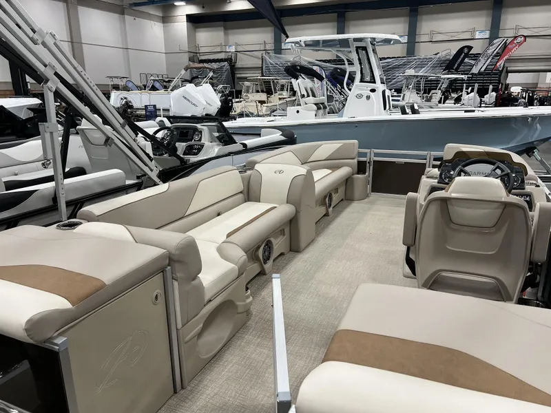 Slide: The Image of 2023 Avalon 2185 Venture CR2 pontoon boat interior at a boat show. - 18