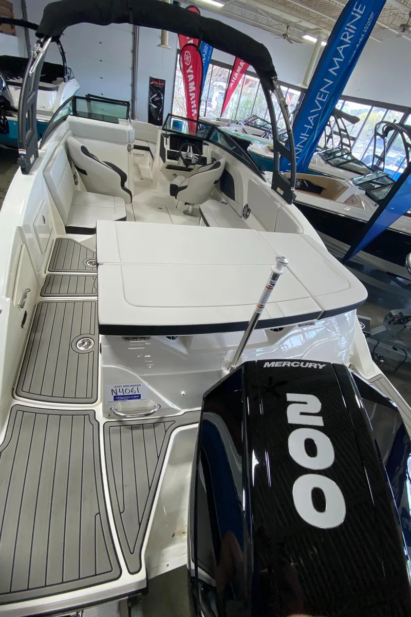 Slide: The Image of 2023 Sea Ray SPX 230 OB boat with Mercury 200 outboard engine in showroom. - 7
