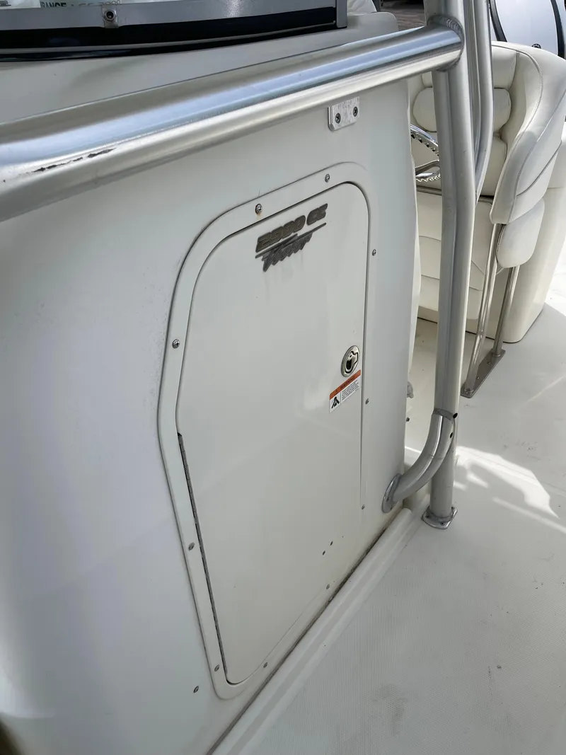 Slide: The Image of 2009 Hydra-Sports 2900 CC boat interior with storage compartment and seating. - 10