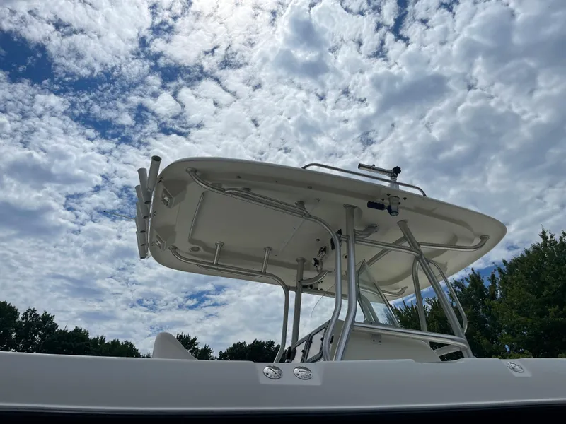 Slide: The Image of 2009 Hydra-Sports 2900 CC boat under a partly cloudy sky. - 13