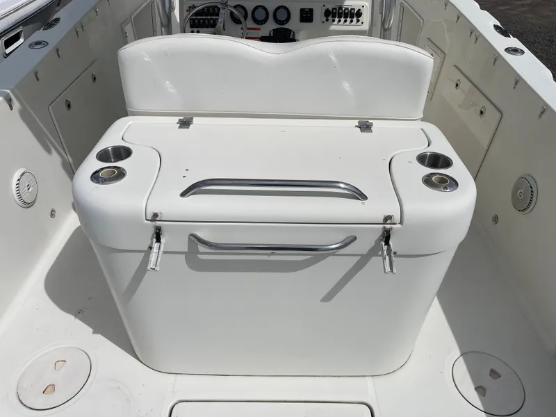 Slide: The Image of 2009 Hydra-Sports 2900 CC boat interior with storage compartment and cup holders. - 16