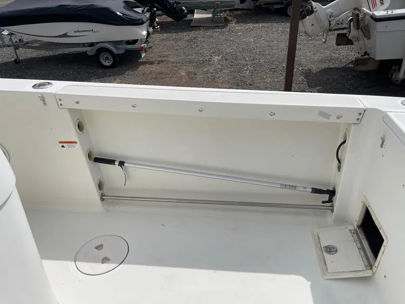 Slide: The Image of 2009 Hydra-Sports 2900 CC boat deck with storage compartment and rod holder. - 21