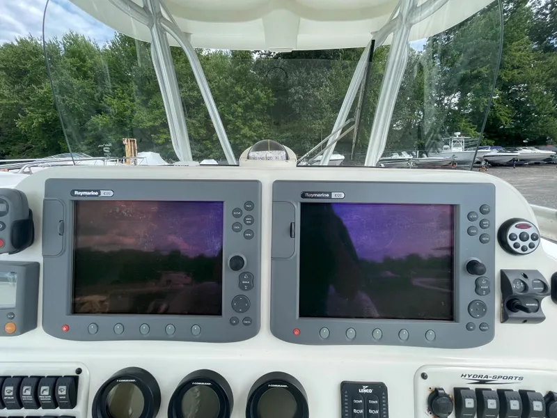 Slide: The Image of 2009 Hydra-Sports 2900 CC boat dashboard with dual Raymarine displays. - 25