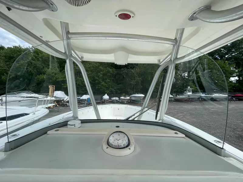 Slide: The Image of 2009 Hydra-Sports 2900 CC boat console and windshield view in a marina. - 27