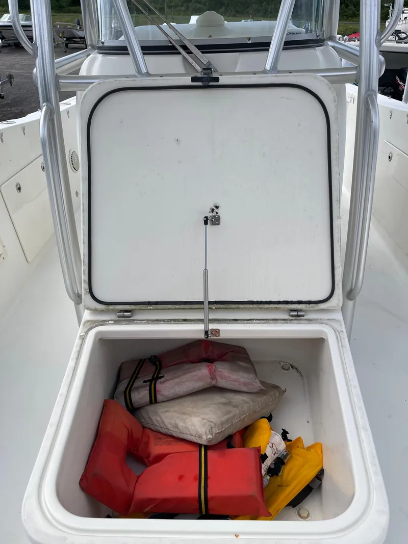 Slide: The Image of 2009 Hydra-Sports 2900 CC boat with open storage compartment containing life jackets. - 34