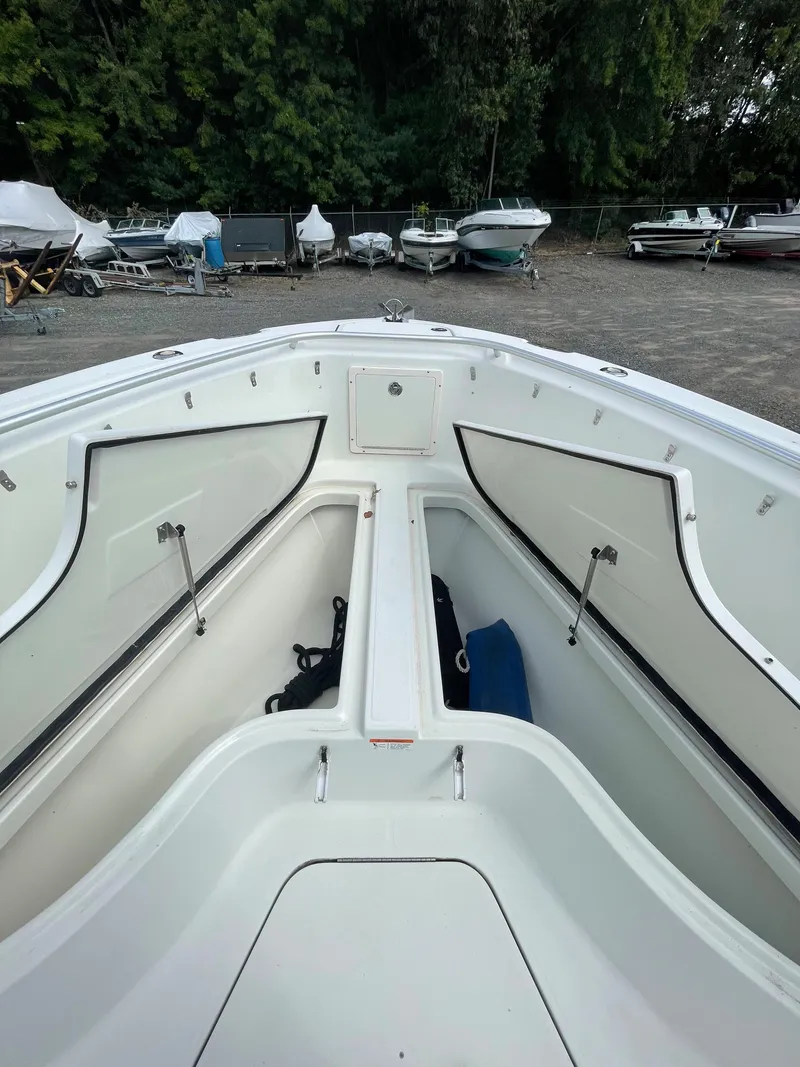Slide: The Image of 2009 Hydra-Sports 2900 CC boat with open storage compartments. - 35