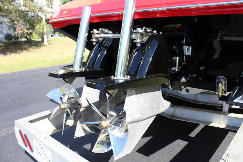 Slide: The Image of Rear view of a 2007 Fountain 42 Lightning with two shiny propellers on a trailer. - 10