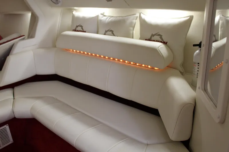 Slide: The Image of Interior of the 2007 Fountain 42 Lightning with white leather seating and decorative cushions. - 42