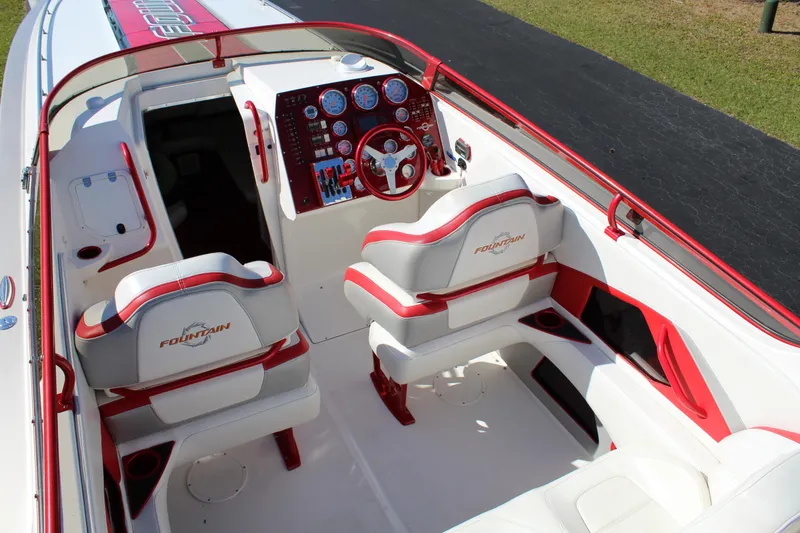 Slide: The Image of The image shows the cockpit of a 2007 Fountain 42 Lightning boat with red and white seating. - 31