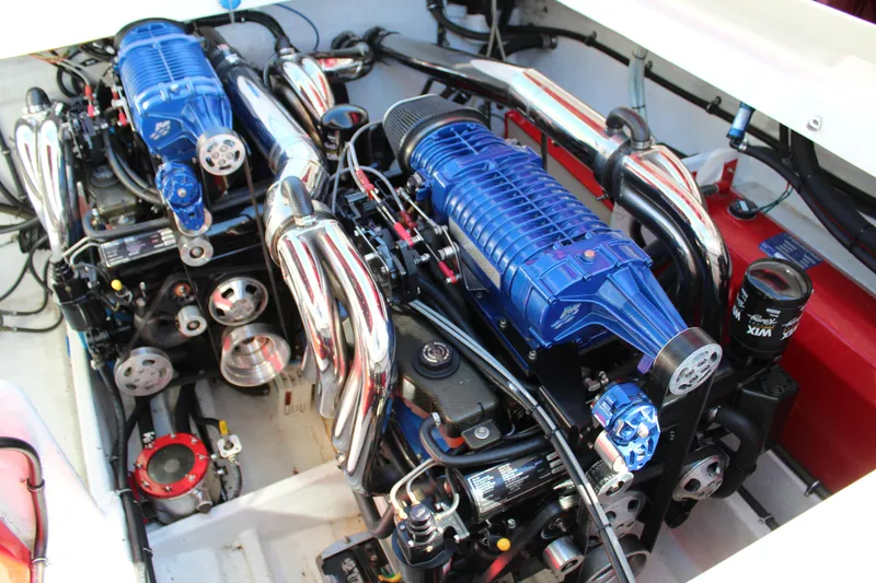 Slide: The Image of Engine compartment of a 2007 Fountain 42 Lightning with two powerful engines and shiny exhaust pipes. - 35