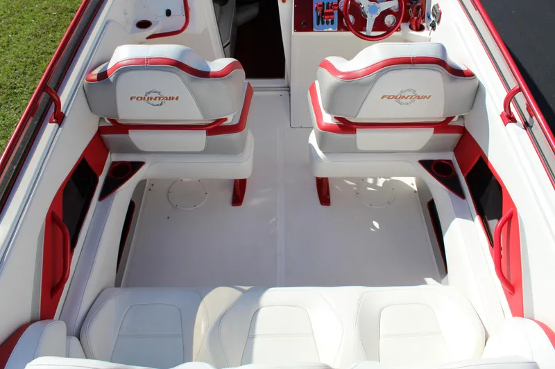 Slide: The Image of The image shows the cockpit of a 2007 Fountain 42 Lightning boat with white and red seating. - 29