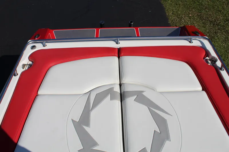 Slide: The Image of Red and white upholstery on a boat with a lightning pattern, surrounded by metal railings. - 25