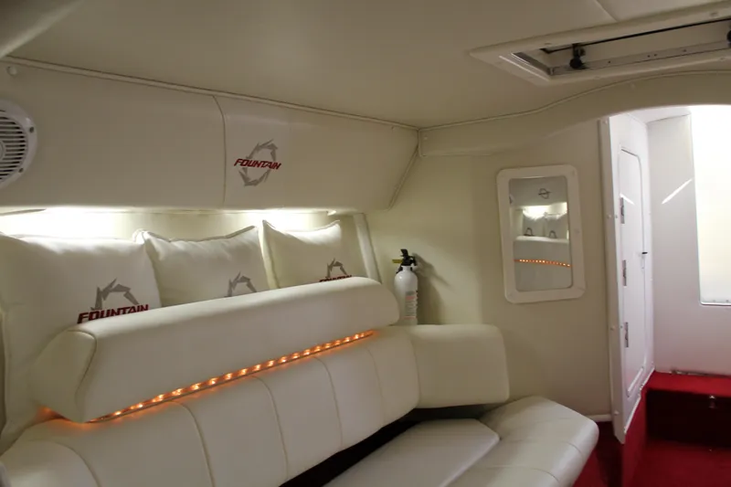 Slide: The Image of Interior of a 2007 Fountain 42 Lightning with white upholstery and red accents. - 44