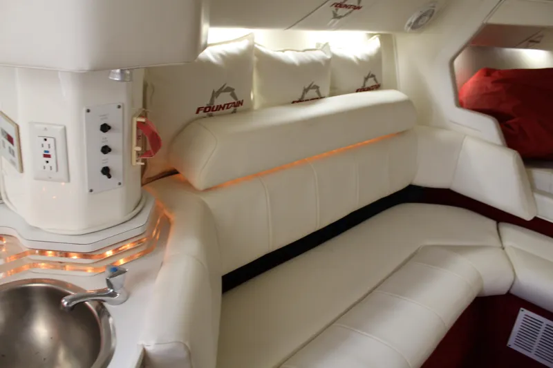 Slide: The Image of Interior of the 2007 Fountain 42 Lightning with white upholstery and a small sink. - 43