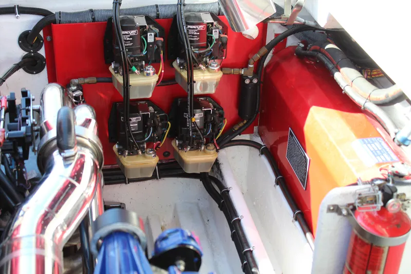 Slide: The Image of The engine compartment of a 2007 Fountain 42 Lightning boat shows multiple engines and wiring. - 36