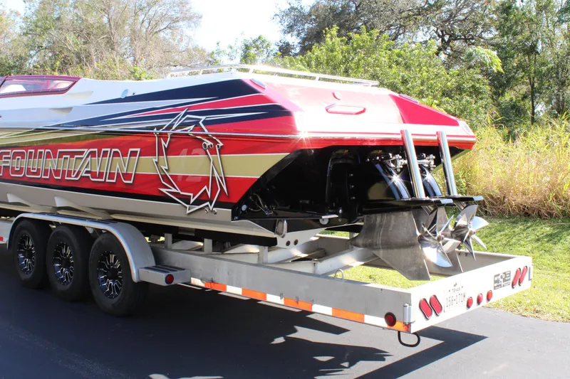 Slide: The Image of 2007 Fountain 42 Lightning in red and white on a trailer. - 6