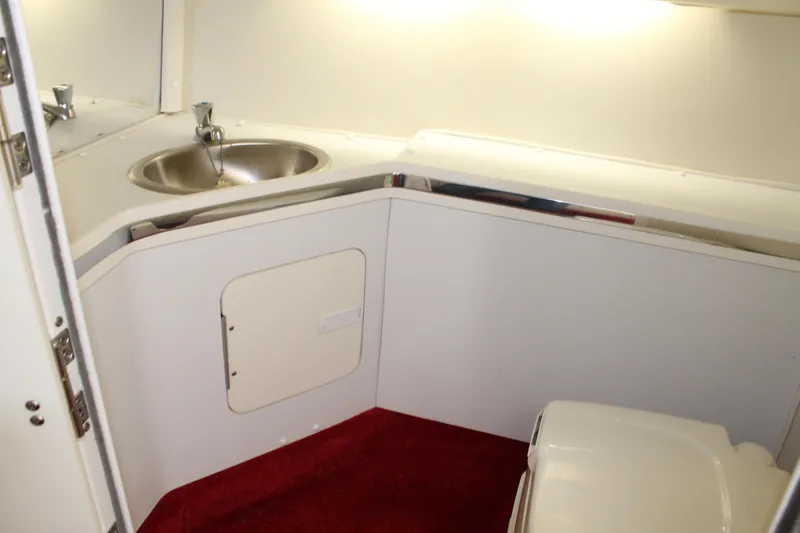 Slide: The Image of The image shows the bathroom of a 2007 Fountain 42 Lightning with a sink and toilet. - 47