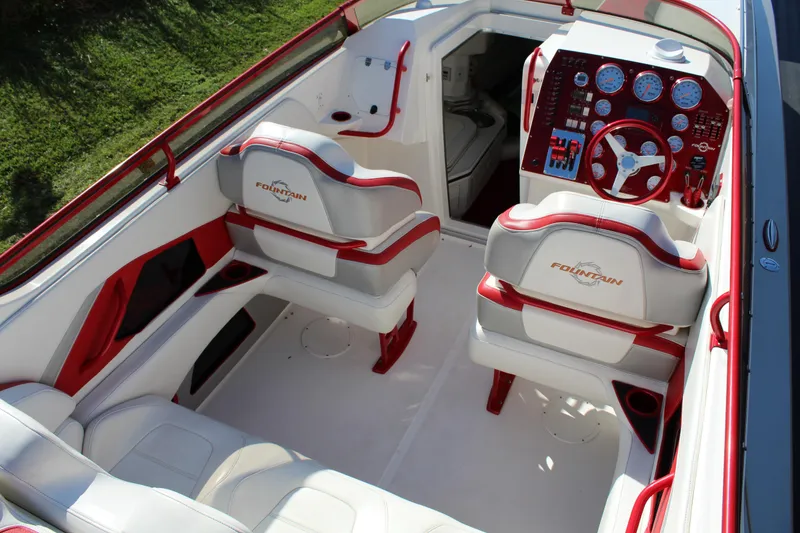 Slide: The Image of The image shows the cockpit of a 2007 Fountain 42 Lightning boat with red and white seating. - 30