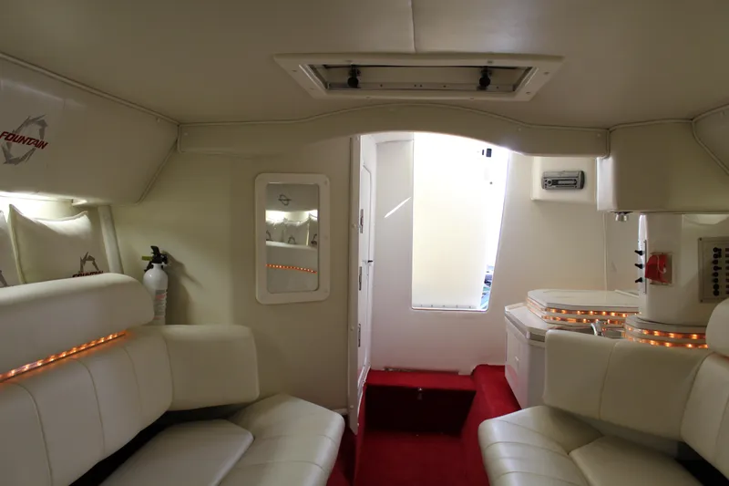 Slide: The Image of Interior of the 2007 Fountain 42 Lightning with white leather seating and red carpet. - 41