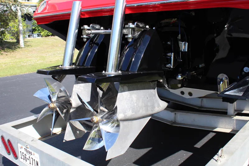 Slide: The Image of Close-up of the shiny propellers on a 2007 Fountain 42 Lightning boat on a trailer. - 11