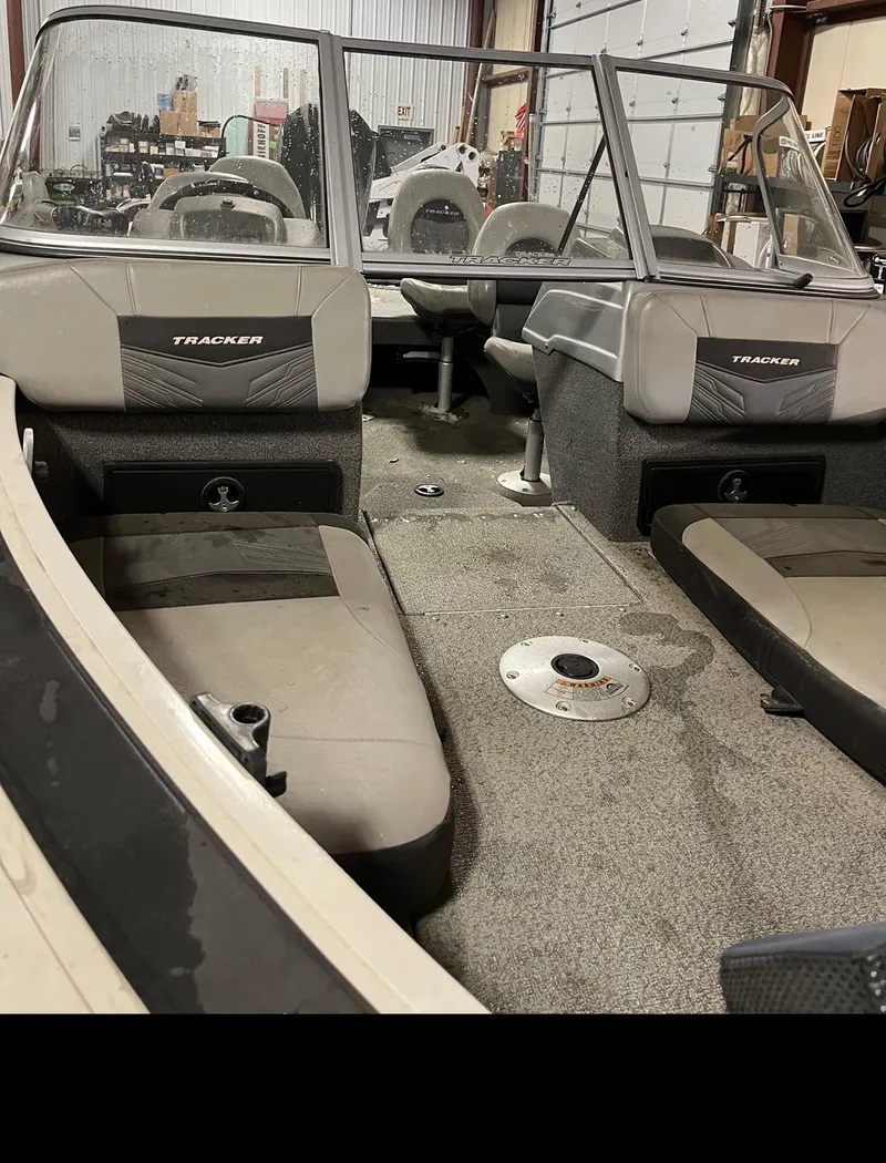Slide: The Image of 2019 Tracker Targa V-19 Combo TE boat interior with seating and storage compartments. - 10