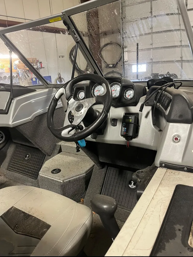 Slide: The Image of 2019 Tracker Targa V-19 Combo TE boat interior with steering wheel and dashboard. - 5
