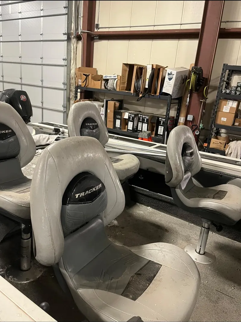 Slide: The Image of 2019 Tracker Targa V-19 Combo TE boat seats in a garage. - 6