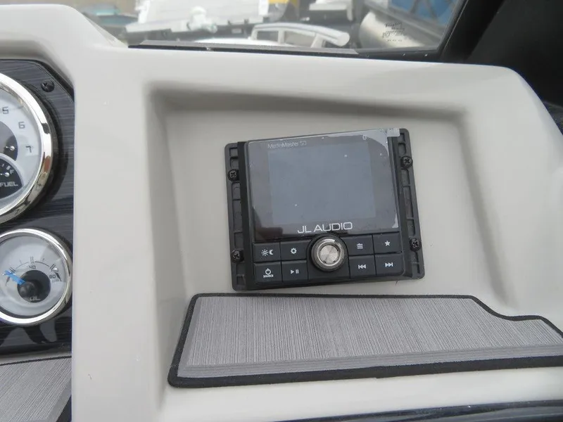 Slide: The Image of 2023 Starcraft SVX IO 210 dashboard with JL Audio system. - 14