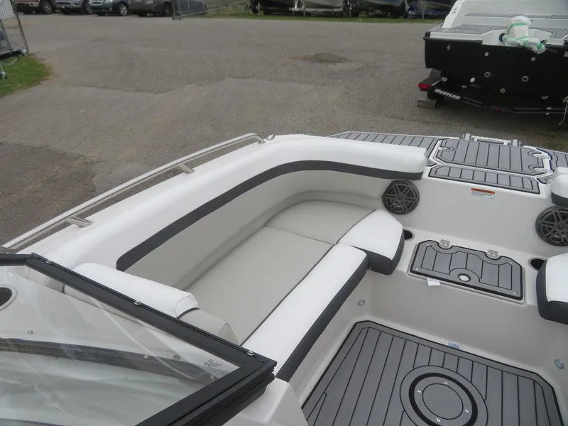 Slide: The Image of 2023 Starcraft SVX IO 210 boat interior with white and gray seating. - 15