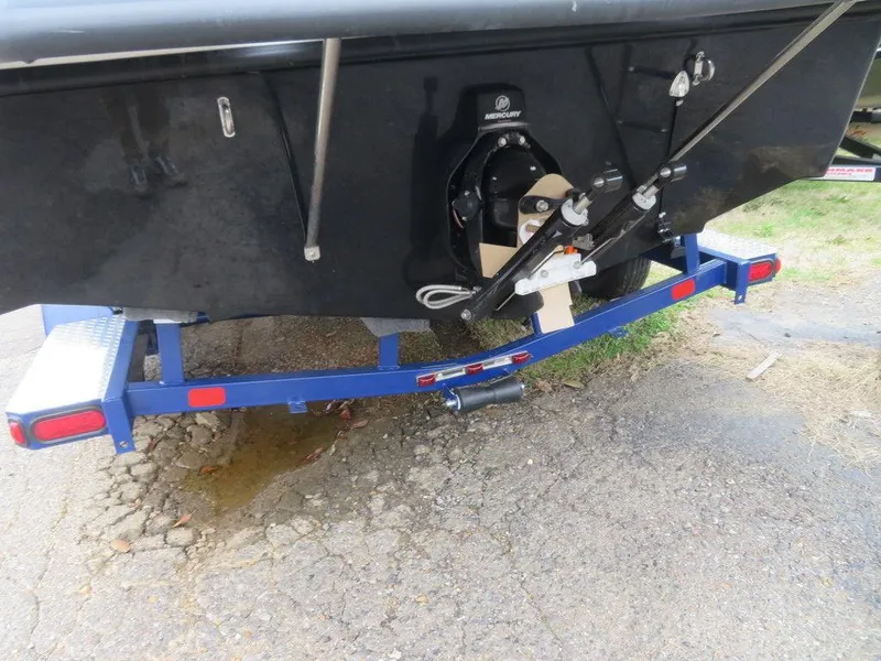 Slide: The Image of 2023 Starcraft SVX IO 210 boat on blue trailer, rear view. - 18