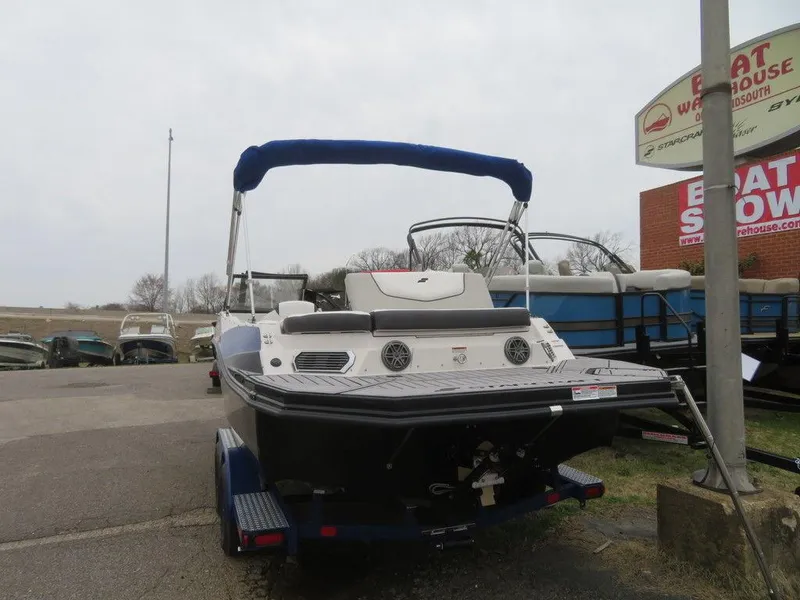 Slide: The Image of 2023 Starcraft SVX IO 210 boat on trailer at dealership. - 19