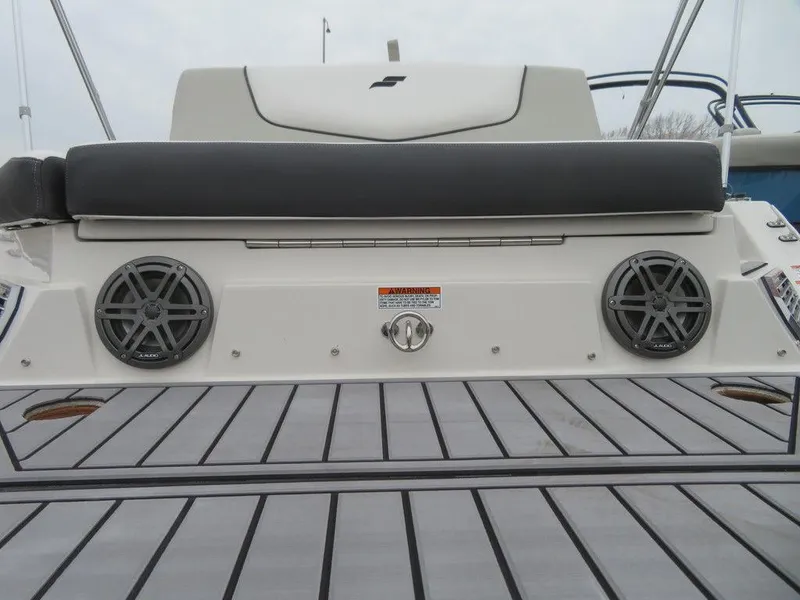 Slide: The Image of 2023 Starcraft SVX IO 210 boat rear deck with speakers and seating. - 20