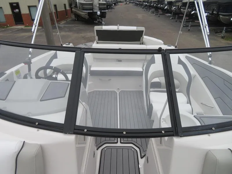 Slide: The Image of 2023 Starcraft SVX IO 210 boat interior with seating and steering wheel. - 3