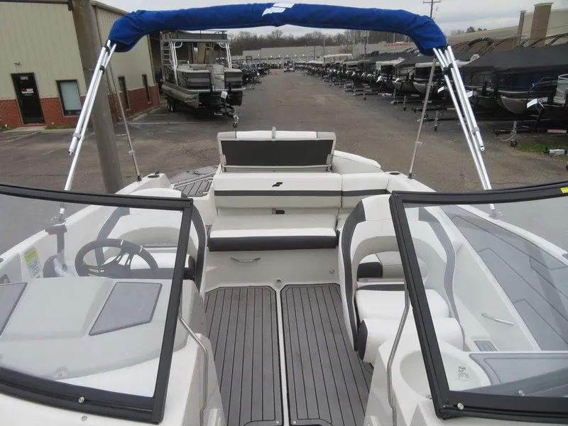 Slide: The Image of 2023 Starcraft SVX IO 210 boat interior with seating and windshield. - 4