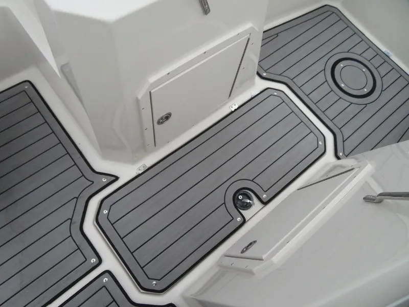 Slide: The Image of 2023 Starcraft SVX IO 210 boat deck with gray non-slip flooring. - 7