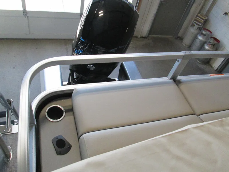 Slide: The Image of 2023 Sun Tracker SportFish 22 XP3 boat interior with motor and seating. - 16
