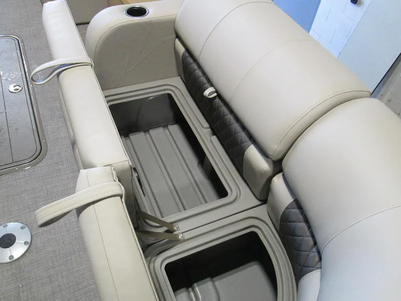 Slide: The Image of 2023 Sun Tracker SportFish 22 XP3 boat with open storage compartments. - 19