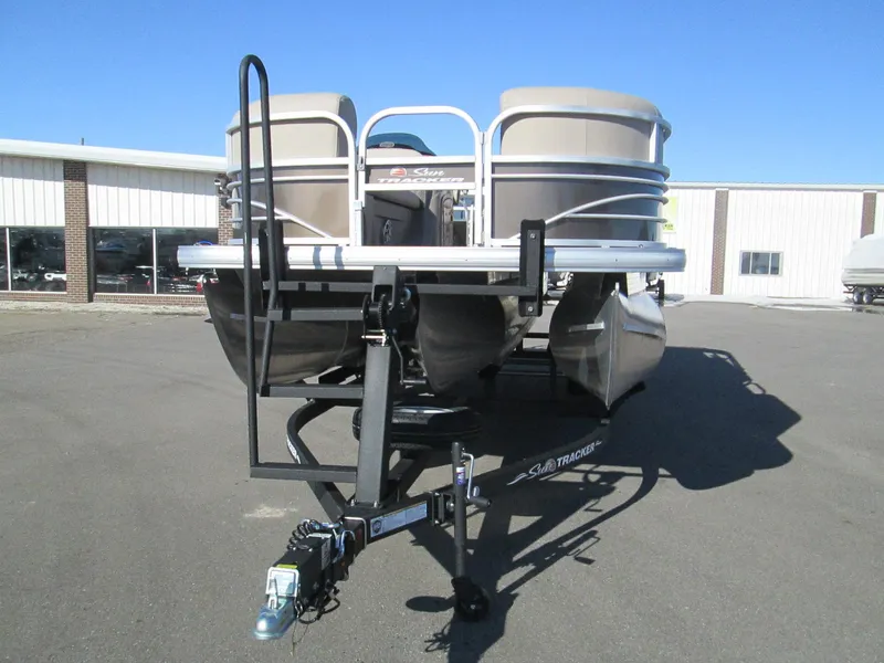 Slide: The Image of 2023 Sun Tracker SportFish 22 XP3 pontoon boat on trailer. - 2
