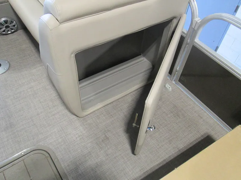 Slide: The Image of 2023 Sun Tracker SportFish 22 XP3 storage compartment with open door. - 20