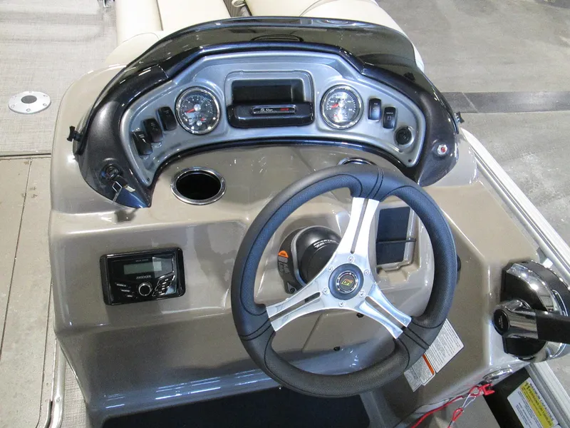 Slide: The Image of 2023 Sun Tracker SportFish 22 XP3 boat dashboard with steering wheel and instrument panel. - 6