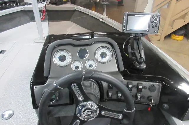 Slide: The Image of 2023 Smoker Craft Pro Angler XL 171 dashboard with steering wheel and fish finder. - 8