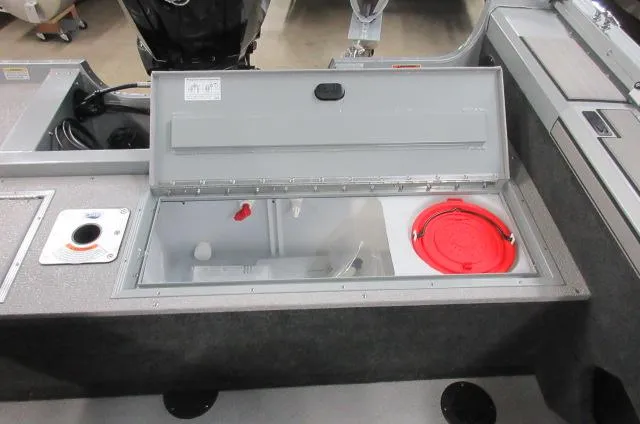 Slide: The Image of 2023 Smoker Craft Pro Angler XL 171 boat storage compartment with open lid. - 9